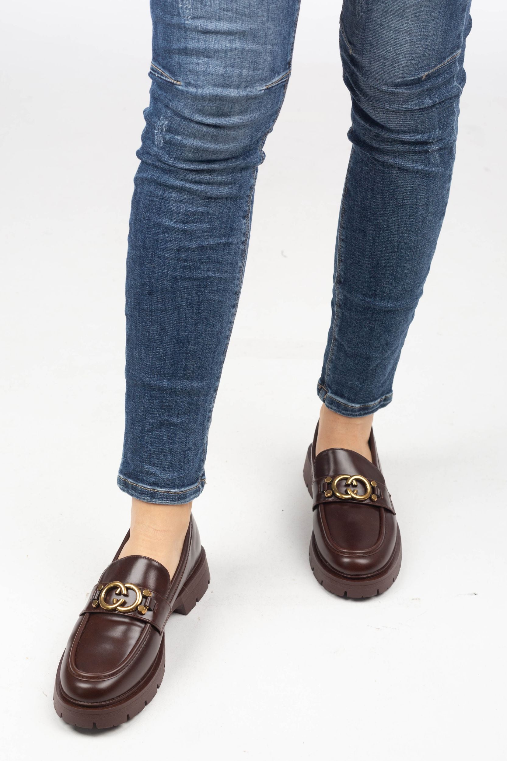 Loafer with a golden buckle